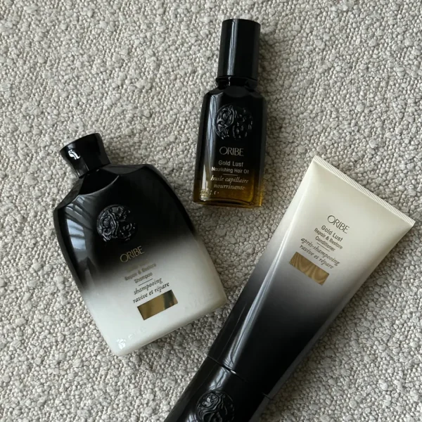 Oribe Gold Lust hårplejeprodukter, herunder shampoo, balsam og hårolie